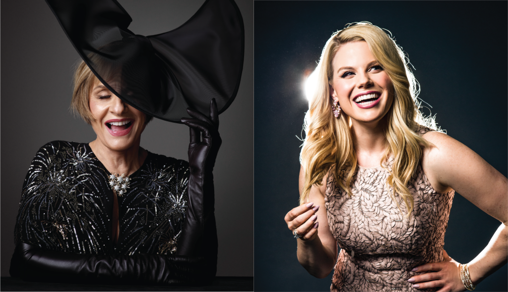 On the left, a laughing blonde woman stands in front of a spotlight wearing an elegant cream beaded dress with stunning pink lipstick and matching earrings. On the right, another laughing woman with cropped, light brown hair poses with a wide, semi-opaque black hat between her fingers. The brim of the hat covers her right eye. She wears elbow-length black leather gloves and a sequined black gown with a brooch made of a cluster of silver stars.